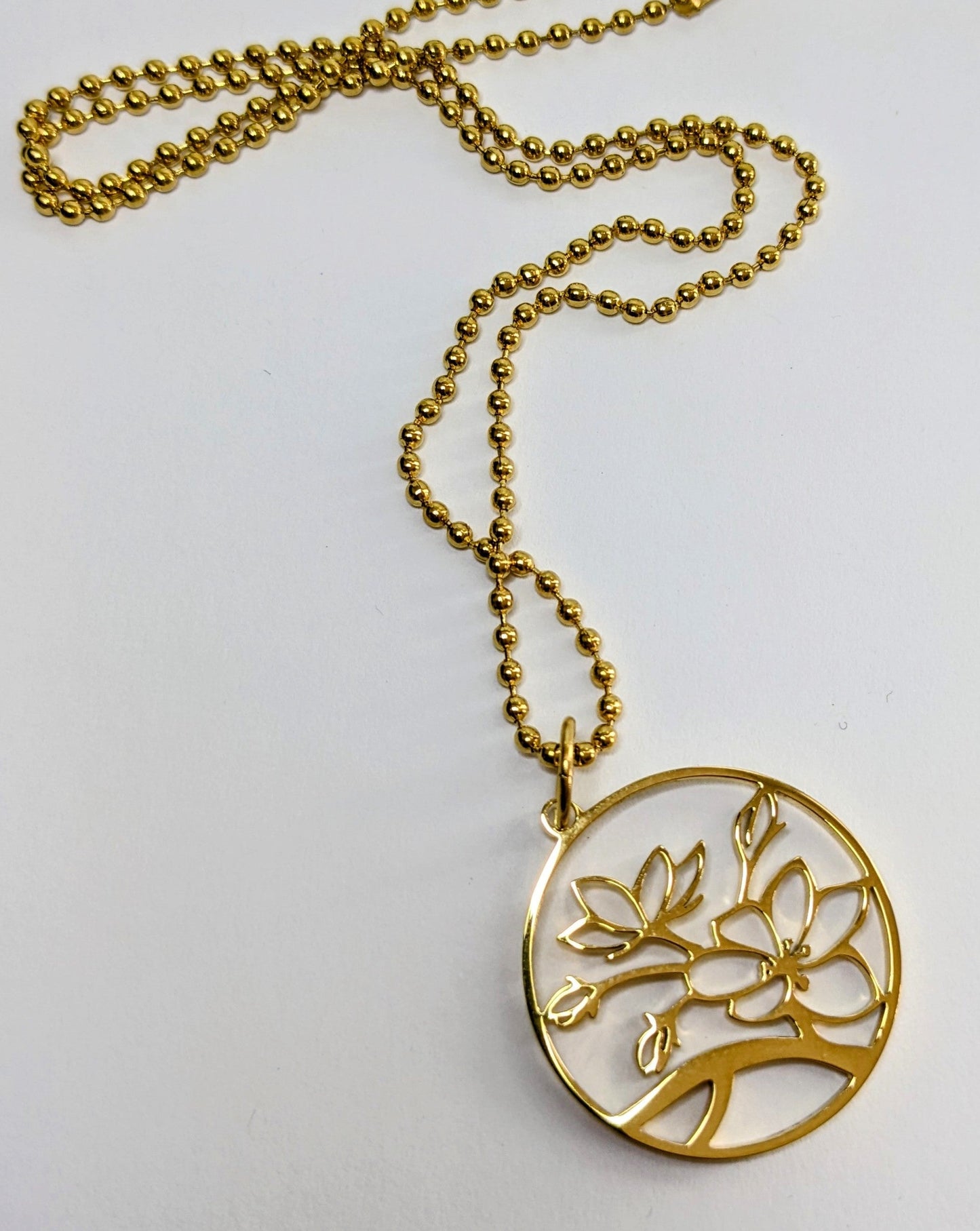 Stainless steel blossom charm necklace gold plated