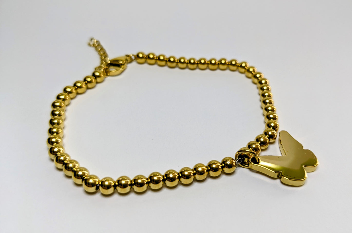 Stainless steel bead bracelet with butterfly charm