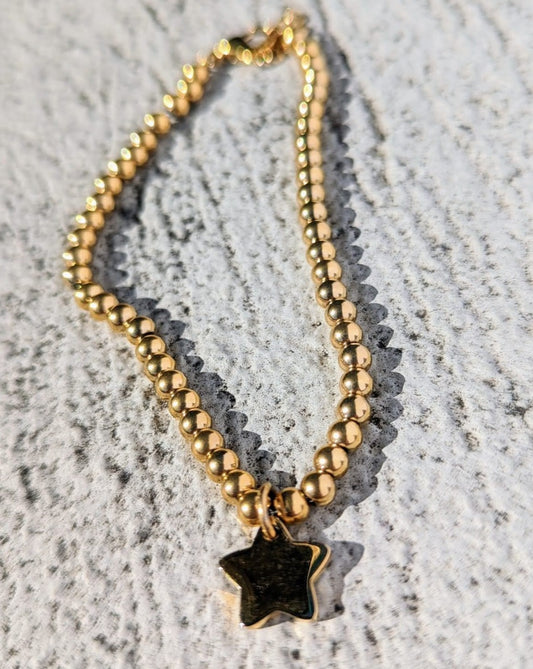 Stainless steel bead bracelet with star charm gold plated