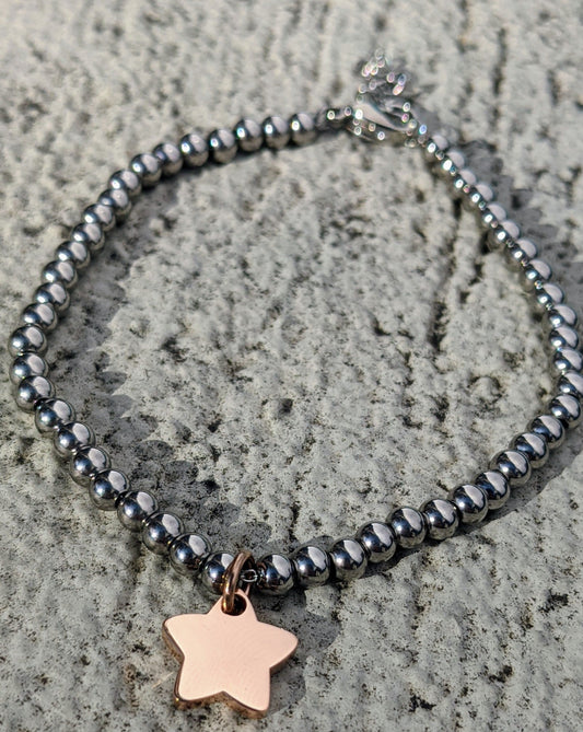 Polished stainless steel bracelet & rose gold plated star charm